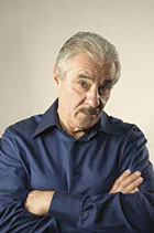 This photo shows a serious man ready to discuss the Spanish language. 